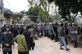 Fallecen tres policías en disturbios en comuna suburbana de Hanoi