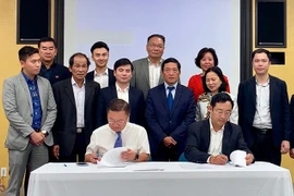 Firman acuerdo sobre asistencia financiera a emprendedores vietnamitas 