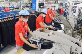 Producción de prendas de vestir para exportación en Corporation Textil May 10 (Foto: hanoimoi.vn)