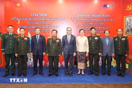 Los delegados de Vietnam y Laos en el evento (Fuente: VNA)