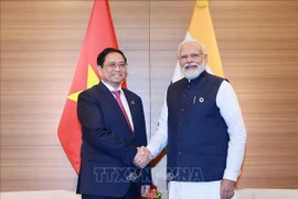 El primer ministro de Vietnam, Pham Minh Chinh, y su homólogo indio Narendra Modi (Fuente: VNA)
