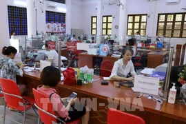 En una sucursal de Agribank en Lao Cai (Foto: VNA)