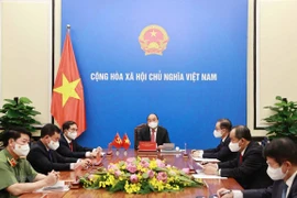 Presidente de Vietnam aboga por impulso de cooperación contra COVID-19 con China 
