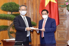 Premier vietnamita pide a Japón continuar cooperando en combate contra pandemia