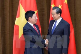 Vicepremier y canciller de Vietnam dialoga con ministro chino de Relaciones Exteriores