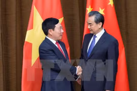 Vicepremier y canciller de Vietnam dialoga con ministro chino de Relaciones Exteriores