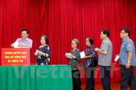 Comunidad vietnamita en Laos inicia campaña de donación para afectados por tifones