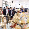 La promoción comercial se erige como un puente vital que conecta a empresas, cooperativas y productores con los mercados nacionales e internacionales, contribuyendo a fortalecer la competitividad de los productos vietnamitas. (Foto ilustrativa: VNA)