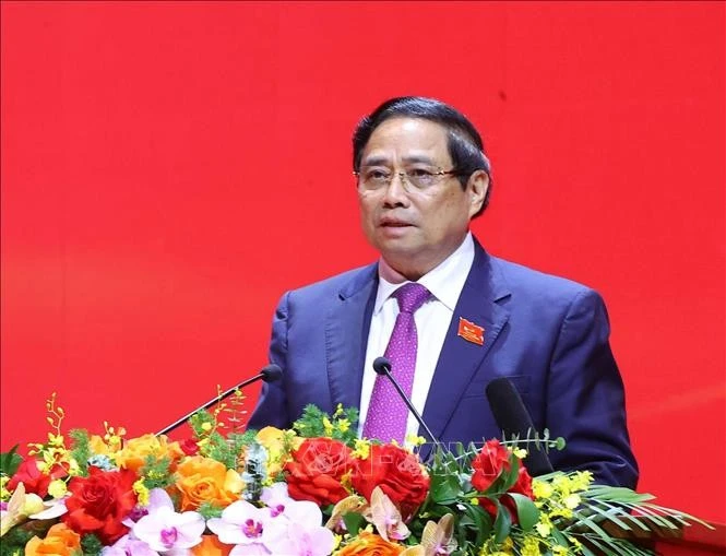 El miembro del Buró Político, secretario del Comité partidista del Gobierno y primer ministro Pham Minh Chinh, habla en la reunión. (Foto: VNA) 