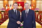El secretario general del PCV, To Lam (derecha) y el presidente francés, Emmanuel Macron (Fuente: VNA)