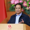 El primer ministro de Vietnam, Pham Minh Chinh, habla en la reunión. (Foto: VNA)