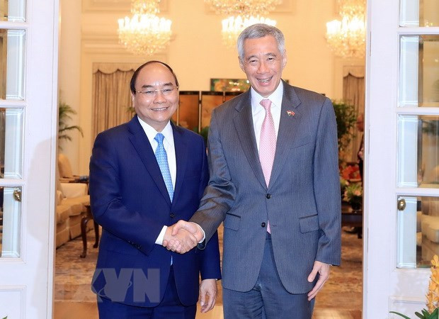 Premieres de Vietnam y Singapur acuerdan elevar nexos bilaterales a nueva altura ảnh 1 Premieres de Vietnam y Singapur acuerdan elevar nexos bilaterales a nueva altura ảnh 1