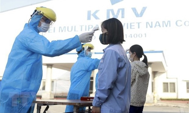 Primer ministro vietnamita insta a garantizar prevención y control del COVID-19 en parques industriales ảnh 1 Primer ministro vietnamita insta a garantizar prevención y control del COVID-19 en parques industriales ảnh 1