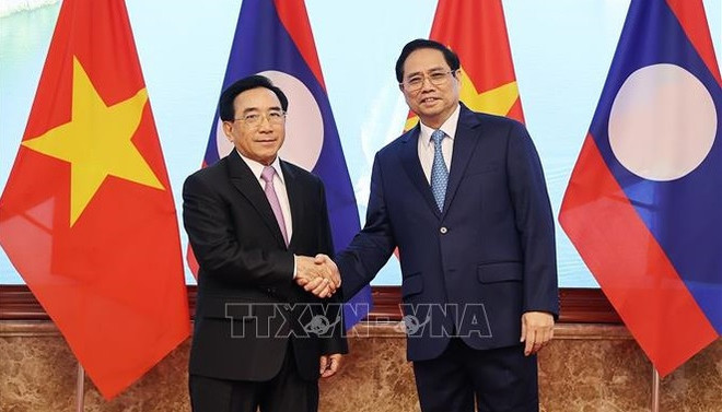 Visita del premier de Vietnam a Laos reafirma solidaridad invariable entre ambos países ảnh 1 Visita del premier de Vietnam a Laos reafirma solidaridad invariable entre ambos países ảnh 1