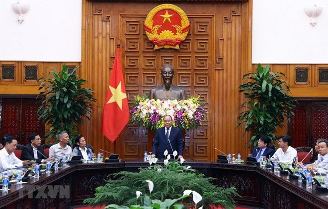 Premier vietnamita se reúne con personas con méritos revolucionarios de ciudad central de Da Nang ảnh 1 Premier vietnamita se reúne con personas con méritos revolucionarios de ciudad central de Da Nang ảnh 1