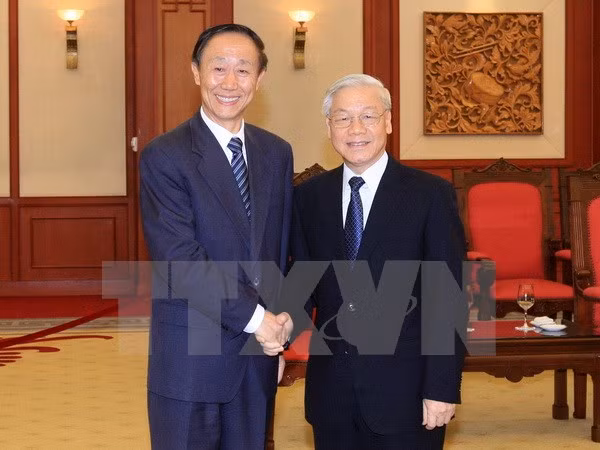  Recibe máximo líder partidista de Vietnam a dirigente chino ảnh 1