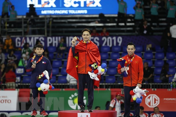Mantiene Vietnam segundo lugar en SEA Games 30 ảnh 1