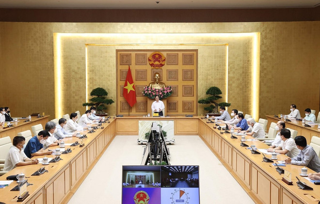 Primer ministro de Vietnam pide buscar medidas para adaptarse de forma segura al COVID-19 ảnh 1