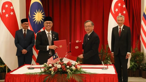 Singapur y Malasia firman acuerdos de cooperación económica ảnh 1 Singapur y Malasia firman acuerdos de cooperación económica ảnh 1