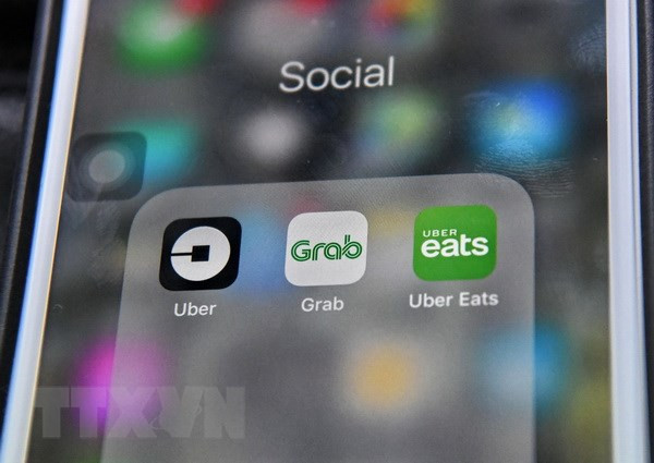 Malasia supervisa fusión de Grab y Uber en Sudeste Asiático ảnh 1
