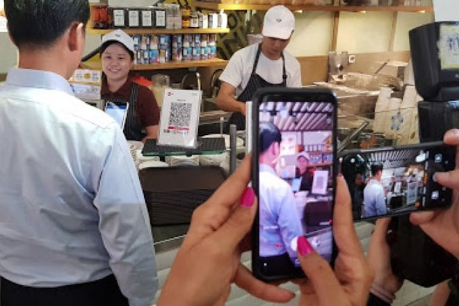 Singapur aplicará un sistema unificado para el pago con código QR ảnh 1