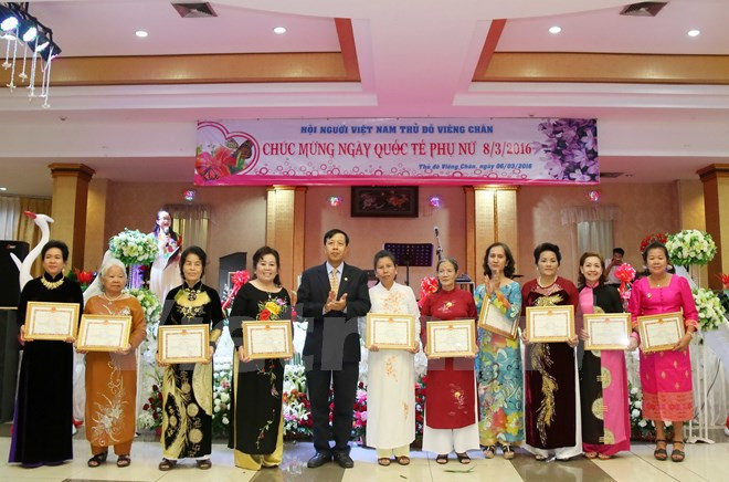Vietnamitas en Laos conmemoran Día Internacional de la Mujer ảnh 1 Vietnamitas en Laos conmemoran Día Internacional de la Mujer ảnh 1