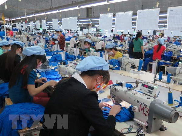 Empresas vietnamitas de confección textil y calzado muestran optimismo para superar impactos del COVID-19 ảnh 1