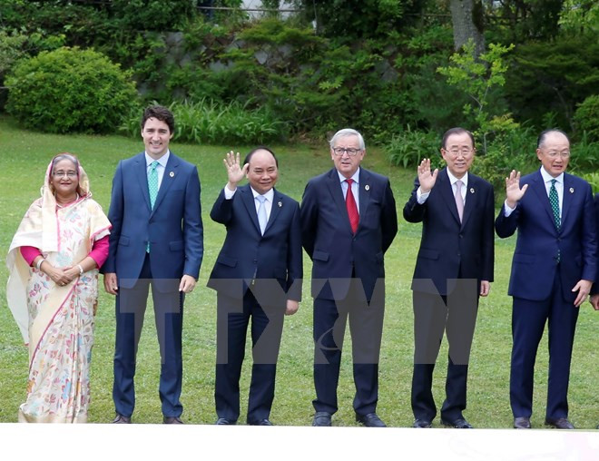 Premier vietnamita se reúne con líderes mundiales en Cumbre ampliada de G7 ảnh 1 Premier vietnamita se reúne con líderes mundiales en Cumbre ampliada de G7 ảnh 1