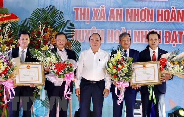 Premier vietnamita en ceremonia de reconocimiento de zonas rurales de nuevo estilo en Binh Dinh ảnh 1 Premier vietnamita en ceremonia de reconocimiento de zonas rurales de nuevo estilo en Binh Dinh ảnh 1