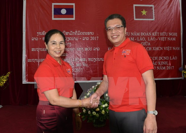 Embajadas de Vietnam y Laos en China celebran aniversario de sus lazos diplomáticos ảnh 1 Embajadas de Vietnam y Laos en China celebran aniversario de sus lazos diplomáticos ảnh 1