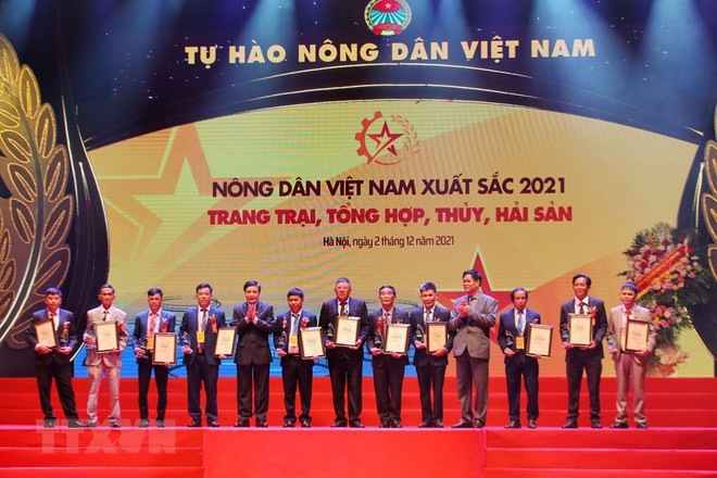 Honran a agricultores destacados de Vietnam en 2021 ảnh 1