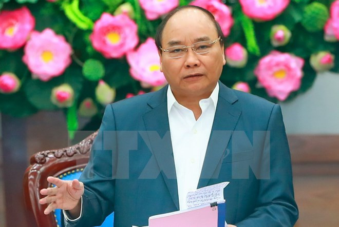 Premier de Vietnam urge a diseñar escenarios de desarrollo para alcanzar objetivo de crecimiento ảnh 1
