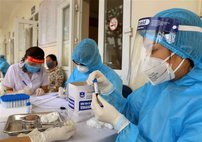 Premier de Vietnam insta a controlar el COVID-19 durante el feriado del Tet ảnh 2 Premier de Vietnam insta a controlar el COVID-19 durante el feriado del Tet ảnh 2