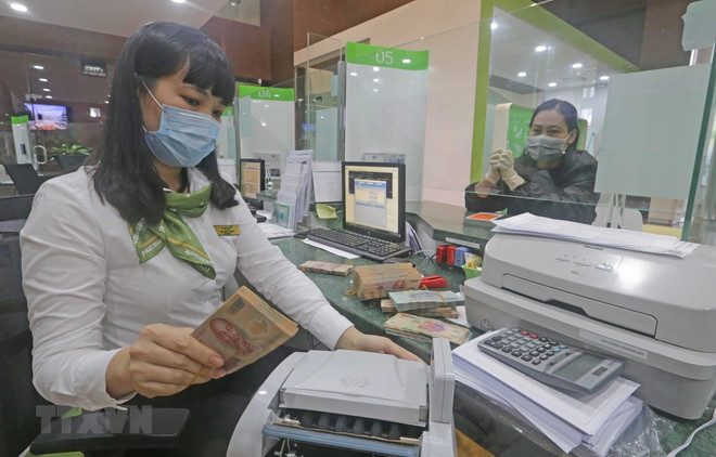 Bancos vietnamitas reportan ganancias en primer trimestre del año ảnh 1