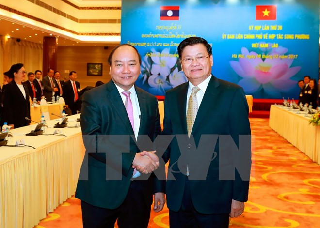 Premier laosiano concluye con éxito visita en Vietnam ảnh 1 Premier laosiano concluye con éxito visita en Vietnam ảnh 1
