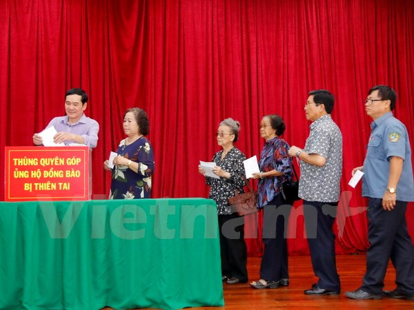 Comunidad vietnamita en Laos inicia campaña de donación para afectados por tifones ảnh 1