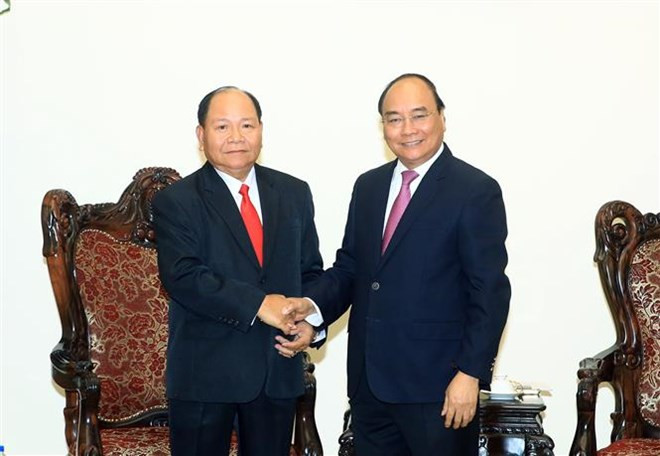 Premier de Vietnam encomia cooperación con Laos en asuntos internos ảnh 1 Premier de Vietnam encomia cooperación con Laos en asuntos internos ảnh 1