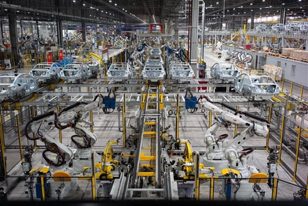 Prensa laosiana aprecia experiencias de Vietnam en desarrollo económico ảnh 1