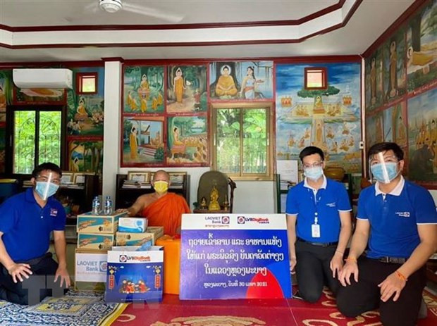 Comunidad vietnamita en Laos se une al gobierno local en prevención y control del COVID-19 ảnh 1 Comunidad vietnamita en Laos se une al gobierno local en prevención y control del COVID-19 ảnh 1