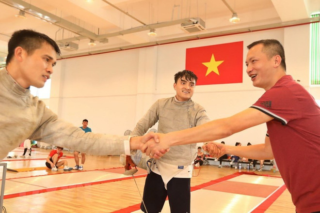 Atletas vietnamitas por realzar la imagen de bandera nacional en los SEA Games 31 ảnh 1