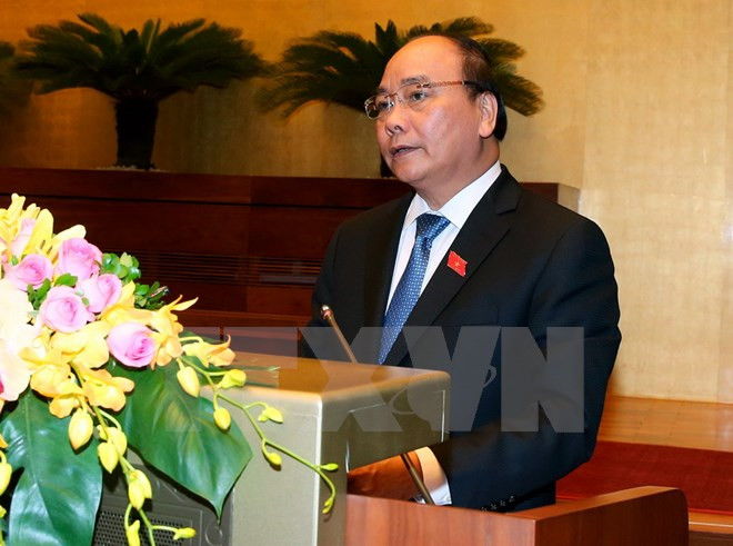 Premier de Vietnam presenta informe socioeconómico ante Parlamento ảnh 1 Premier de Vietnam presenta informe socioeconómico ante Parlamento ảnh 1
