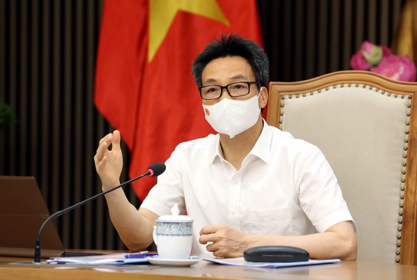 Vicepremier de Vietnam recibe a empresas donantes a fondo nacional de vacunación contra COVID-19 ảnh 2