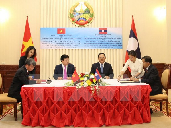 Firman Vietnam y Laos acuerdos de cooperación ảnh 1 Firman Vietnam y Laos acuerdos de cooperación ảnh 1