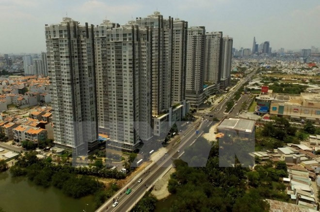 Fitch Solutions ajusta a la baja pronóstico de crecimiento de Vietnam ảnh 1