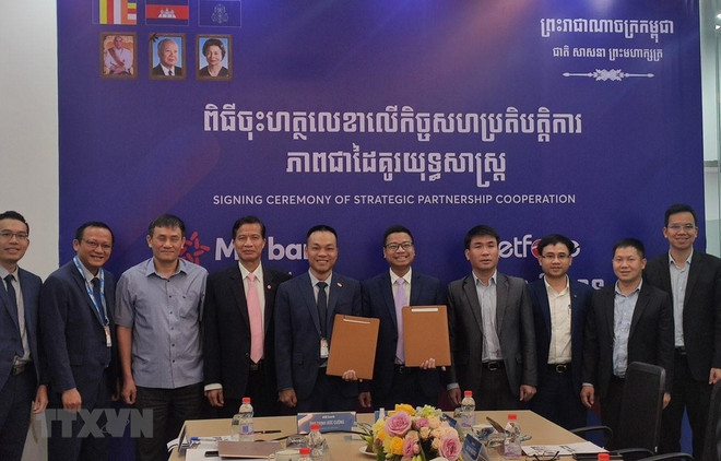 Fortalecen cooperación entre filiales de empresa y banco vietnamitas en Camboya ảnh 1 Fortalecen cooperación entre filiales de empresa y banco vietnamitas en Camboya ảnh 1