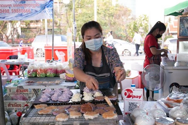 Laos reporta alta tasa de inflación en enero de 2022 ảnh 1