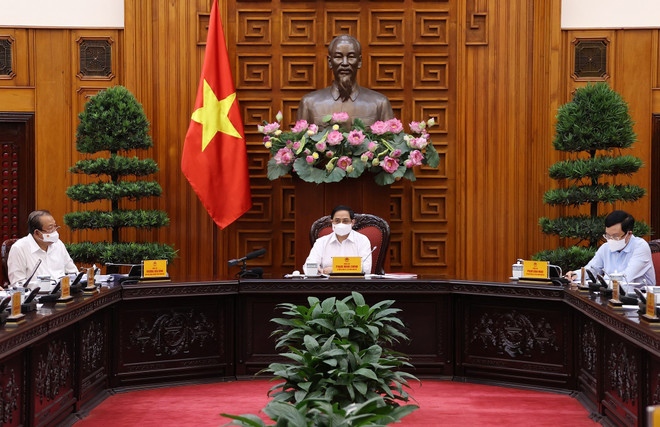 Primer ministro de Vietnam preside reunión sobre la lucha contra COVID-19 ảnh 1 Primer ministro de Vietnam preside reunión sobre la lucha contra COVID-19 ảnh 1