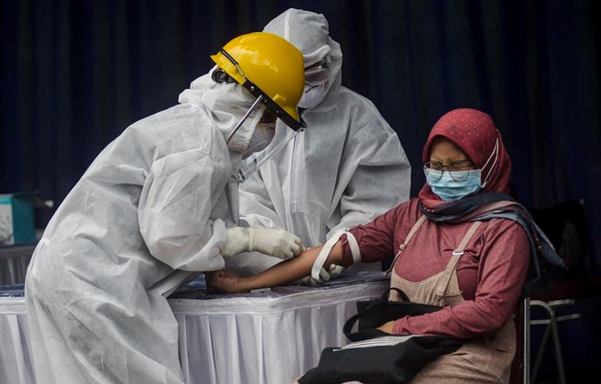 Indonesia amplía restricciones sociales en medio de pandemia ảnh 1 Indonesia amplía restricciones sociales en medio de pandemia ảnh 1