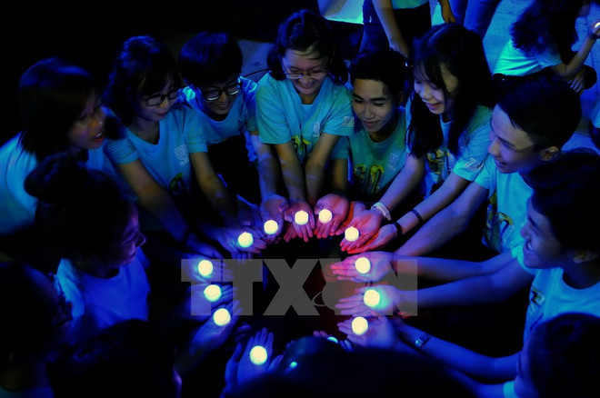 Estudiantes vietnamitas participan en programa Hora del Planeta ảnh 1 Estudiantes vietnamitas participan en programa Hora del Planeta ảnh 1