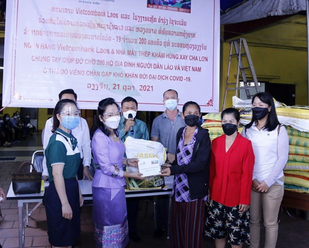 Comunidad vietnamita en Laos muestra solidaridad en medio del COVID-19 ảnh 1 Comunidad vietnamita en Laos muestra solidaridad en medio del COVID-19 ảnh 1